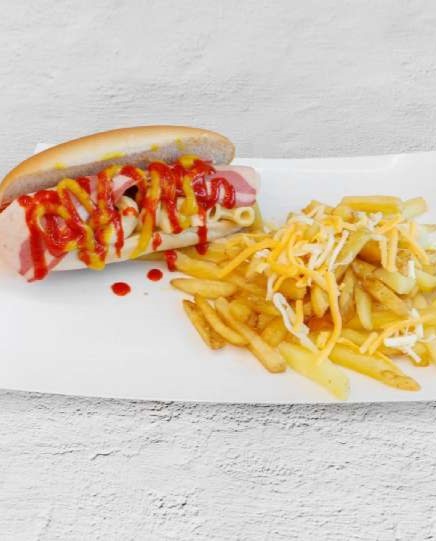 The Burgerzzz in Coatbridge hot dog topped with bacon, mac & cheese, ketchup, and cheesy fries.